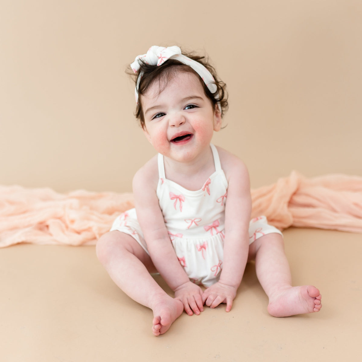 Spaghetti Strap Ruffle Romper in Bow
